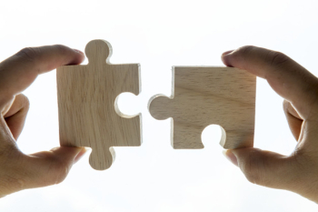 Macro shot of jigsaw puzzles teamwork concept Macro shot of jigsaw puzzles teamwork concept