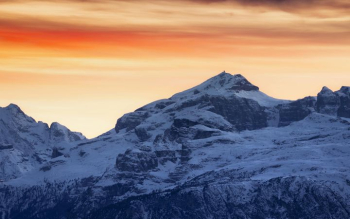 Majestic Snow-Capped Mountains at Sunset Majestic Snow-Capped Mountains at Sunset
