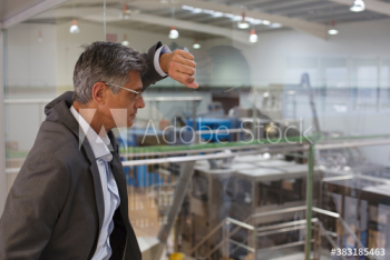 Male manager supervising factory floor Male manager supervising factory floor