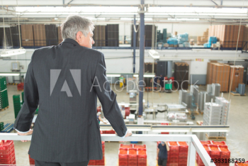 Male manager supervising factory floor Male manager supervising factory floor