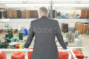 Male manager supervising factory floor Male manager supervising factory floor