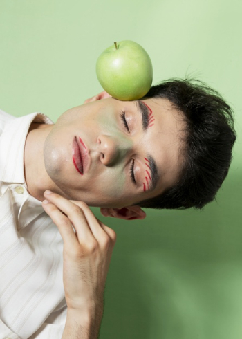 Male model posing with apple Free Photo Male model posing with apple Free Photo
