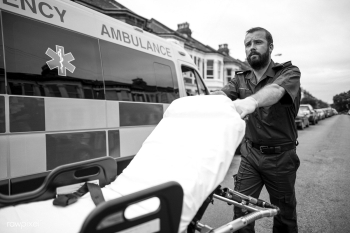 Male paramedic moving the ambulance stretcher | Free stock photo - 515883