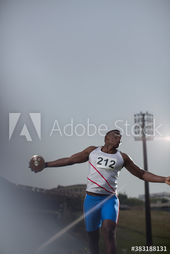 Male track and field athlete throwing discus Male track and field athlete throwing discus