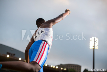 Male track and field athlete throwing shot put Male track and field athlete throwing shot put