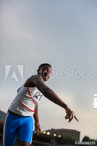 Male track and field athlete throwing shot put Male track and field athlete throwing shot put