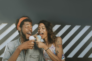 Man and Woman Eating Ice Creams Man and Woman Eating Ice Creams