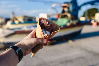 Man and Woman Holding Ice Creams Man and Woman Holding Ice Creams
