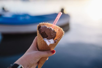 Man and Woman Holding Ice Creams Man and Woman Holding Ice Creams