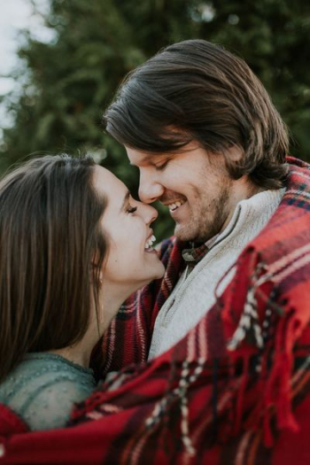 man and woman laughing at each other man and woman laughing at each other
