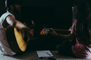 Man and Woman Playing Guitar Man and Woman Playing Guitar