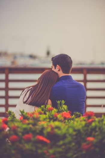 Man and Woman Siting Front of Sea Man and Woman Siting Front of Sea