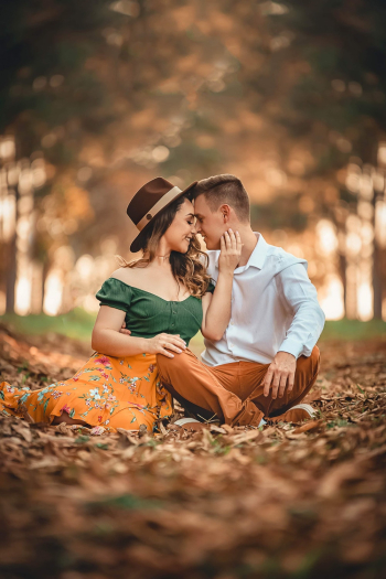 Man and Woman Siting on Ground