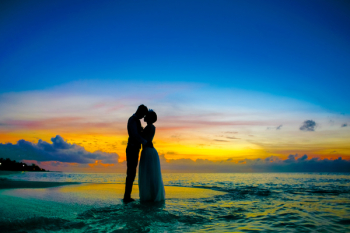 Man and Woman Standing at Seashore Man and Woman Standing at Seashore