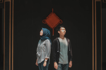 Man and Woman Standing Side-by-side Man and Woman Standing Side-by-side