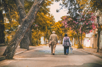Man And Woman Walking On The Street Man And Woman Walking On The Street