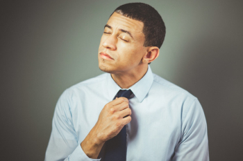 Man Arranging His Black Necktie Man Arranging His Black Necktie