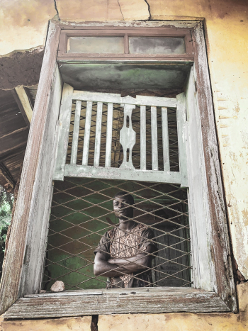 Man Behind Window Man Behind Window