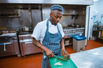 man chopping garlic gloves man chopping garlic gloves