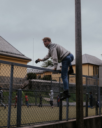 Man Climbing Fence Man Climbing Fence