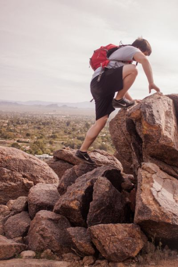 man climbing mountain man climbing mountain