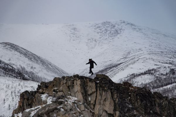 man climbing mountain of snow man climbing mountain of snow