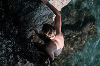 Man Climbing On Cliff Man Climbing On Cliff