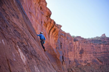 man climbing on mountain rock man climbing on mountain rock