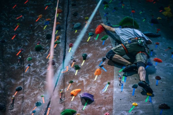 man climbing wall with harness man climbing wall with harness