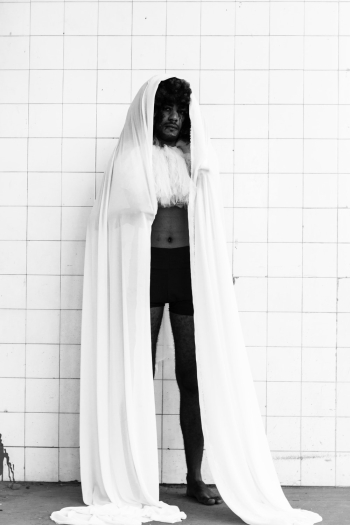 Man Covering Head With White Cloth Man Covering Head With White Cloth