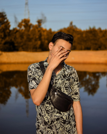Man Covering His Face