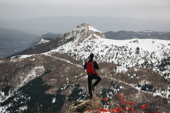 Man Doing One-leg Standing Post on Cliff Man Doing One-leg Standing Post on Cliff