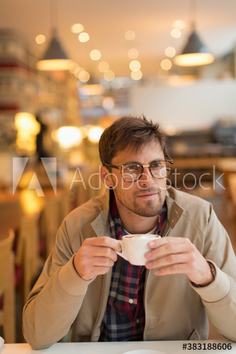 Man drinking cappuccino in cafe Man drinking cappuccino in cafe
