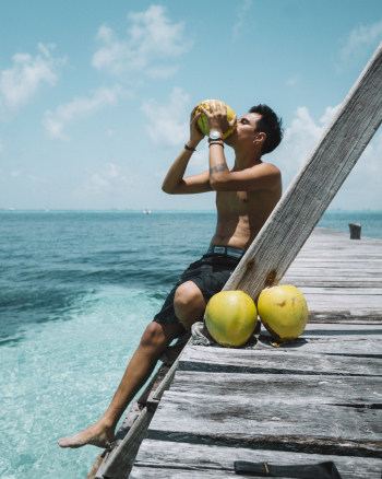 Man Drinking Coconut Man Drinking Coconut