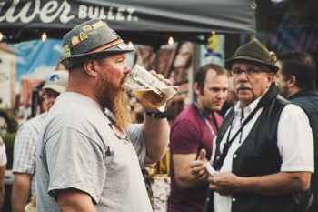 Man Drinking from a Beer Pint Man Drinking from a Beer Pint
