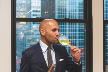 Man Drinking Liquor from Wine Glass Man Drinking Liquor from Wine Glass