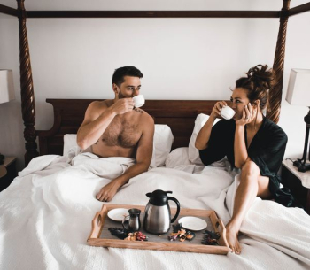 man drinking some coffee beside woman man drinking some coffee beside woman