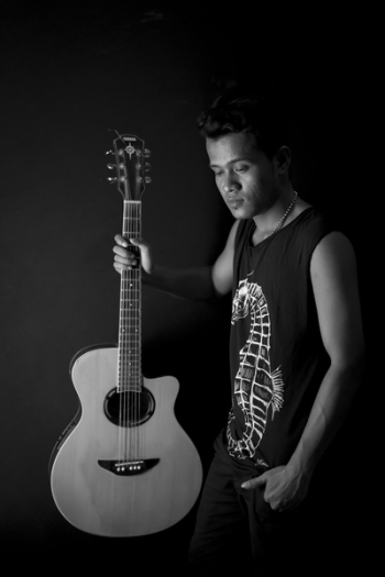 Man Holding Acoustic Guitar Man Holding Acoustic Guitar