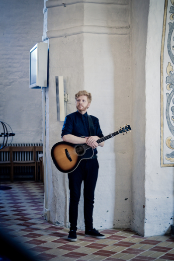 Man Holding Acoustic Guitar Man Holding Acoustic Guitar