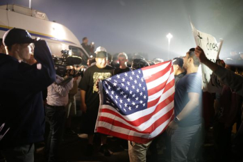 man holding American flag man holding American flag