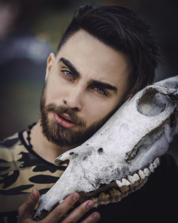 Man Holding Animal Skull Man Holding Animal Skull