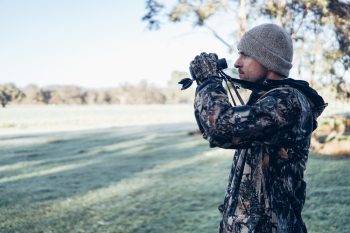 Man Holding Binoculars Man Holding Binoculars