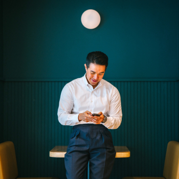 Man Holding Black Smartphone Man Holding Black Smartphone