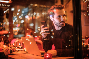 Man Holding Black Smartphone Man Holding Black Smartphone
