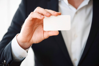 Man holding blank plastic card