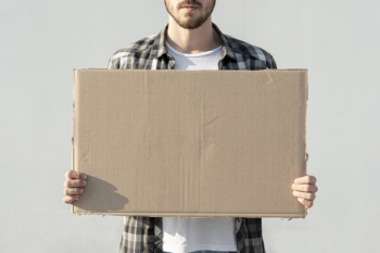 Man holding board with mock-up Free Photo