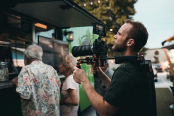 Man Holding Camera Outdoor Watching Above Man Holding Camera Outdoor Watching Above
