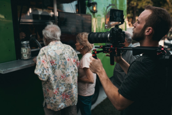 Man Holding Camera With Stabilizer Man Holding Camera With Stabilizer
