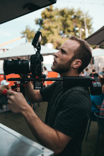 Man Holding Camera With Stabilizer Man Holding Camera With Stabilizer