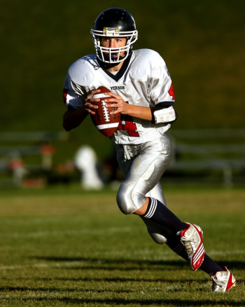 Man Holding Football While Running Man Holding Football While Running